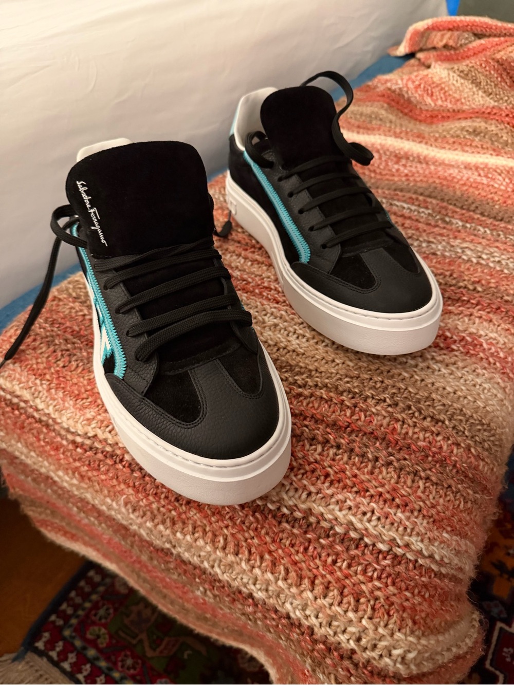 Salvatore Ferragamo Menโs Black Leather Low-Top Sneakers with Teal Accent